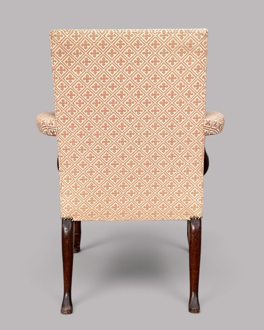 An 18th-century style George II mahogany open armchair upholstered in a cream and red geometric patterned fabric with carved cabriole legs. View VIII