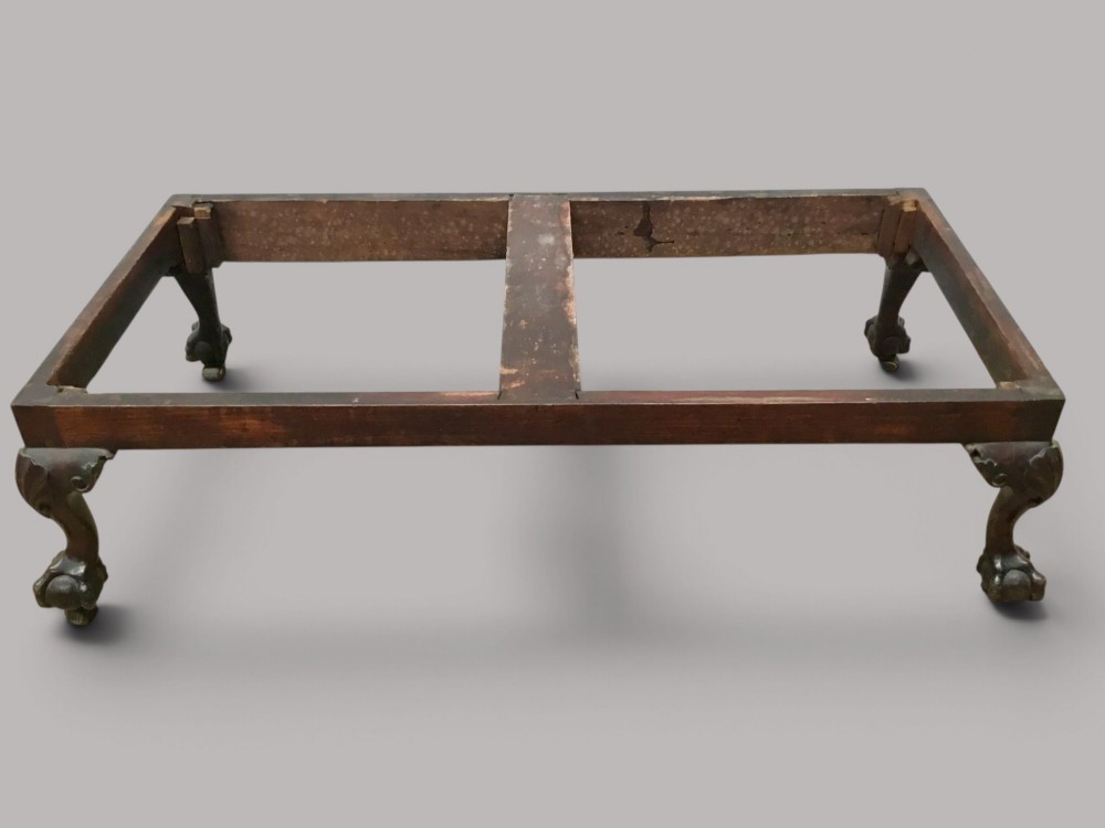 A dark mahogany George II silver chest on stand featuring two lower drawers, brass handles, a central keyhole escutcheon, and carved cabriole legs. View VI