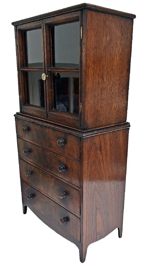 fig 2. A dark mahogany Georgian apprentice chest of four drawers with a removable two-door glazed cabinet upper section.