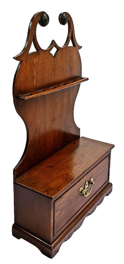 An antique carved oak spoon rack features a shaped scroll crest, a slotted rack, and a lower drawer with a brass drop handle. View III
