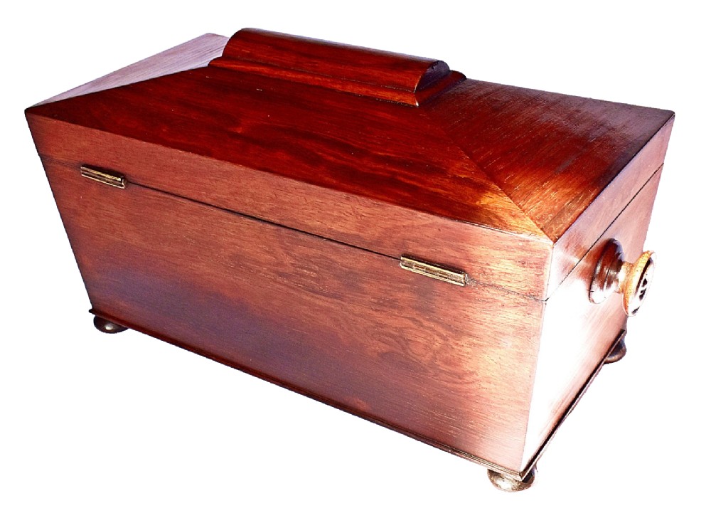 An open William IV sarcophagus-shaped dark wood tea caddy containing two lidded canisters and a central glass mixing bowl. View VI