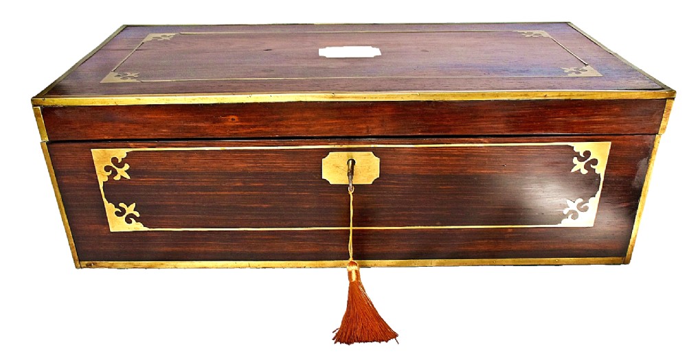 An open antique mahogany writing slope featuring a red gold-tooled leather writing surface, brass corner mounts, and dedicated compartments for inkwells. View II