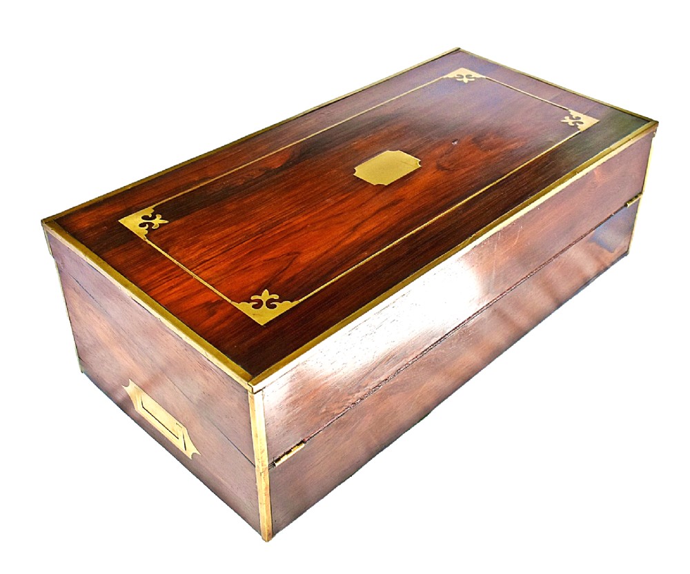 An open antique mahogany writing slope featuring a red gold-tooled leather writing surface, brass corner mounts, and dedicated compartments for inkwells. View III