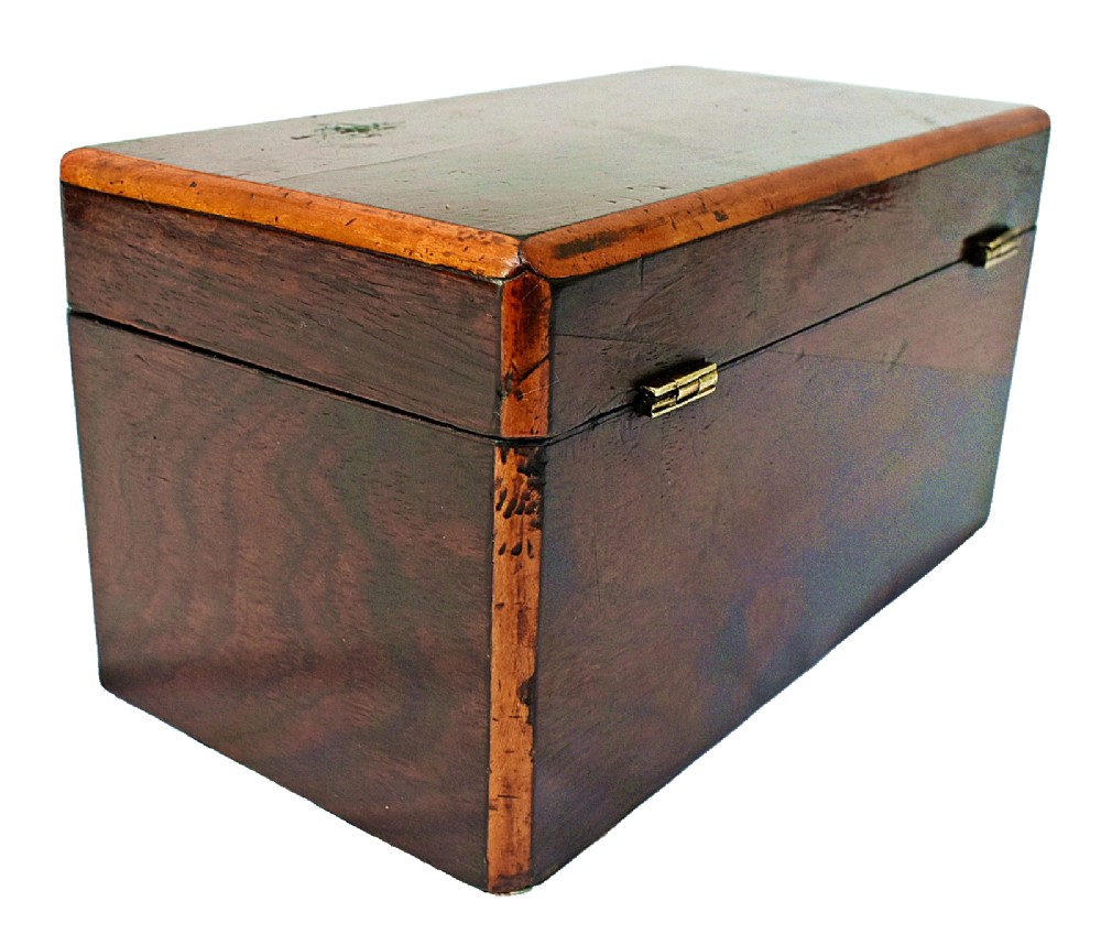 An open dark wood William IV tea caddy featuring two internal lidded compartments, a red embossed paper lining inside the lid, and a brass key with a tassel inserted in the lock. View V