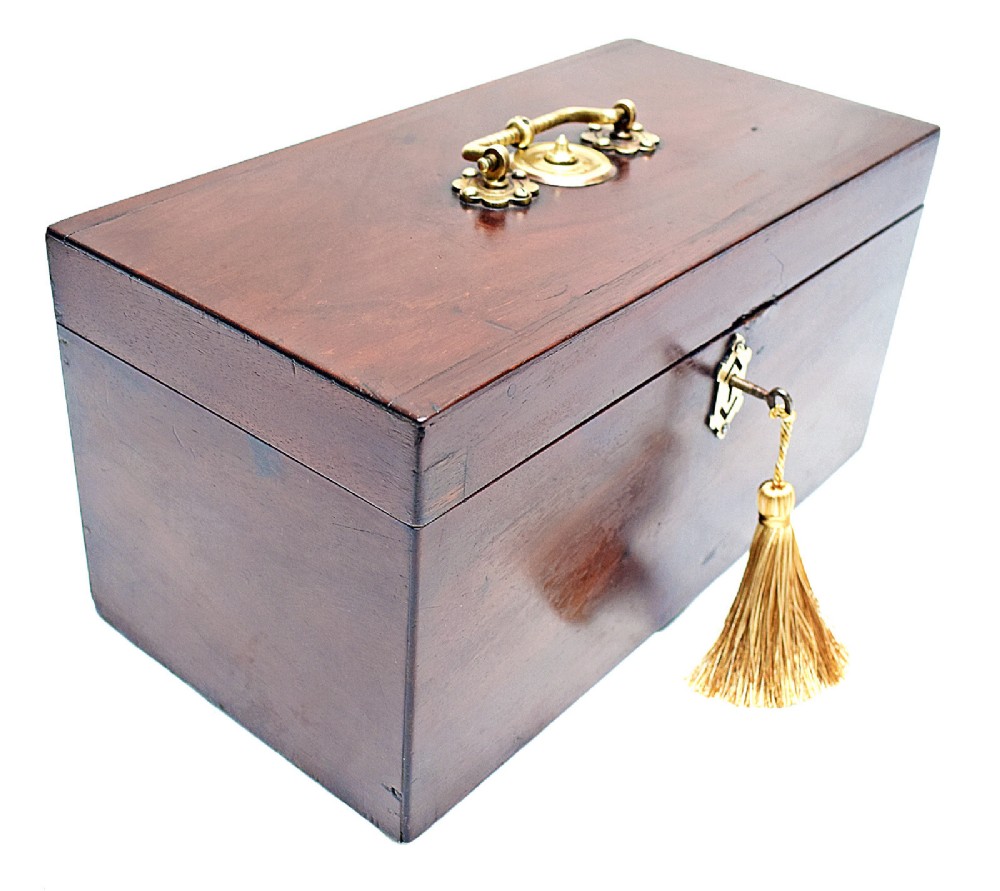 An open rectangular dark wood tea caddy featuring two internal covered compartments, a central cut glass mixing bowl, a green fabric-lined lid, and a key with a tassel inserted in the front lock. View II