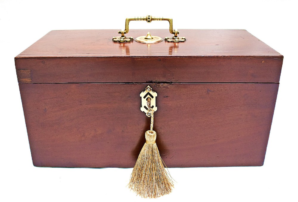An open rectangular dark wood tea caddy featuring two internal covered compartments, a central cut glass mixing bowl, a green fabric-lined lid, and a key with a tassel inserted in the front lock. View IV