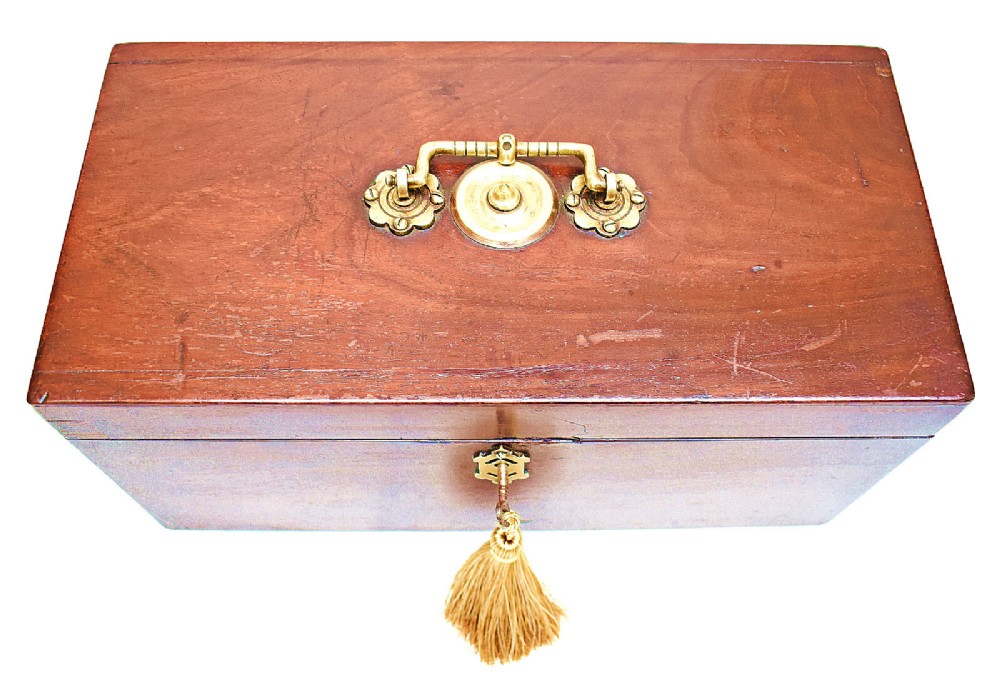 An open rectangular dark wood tea caddy featuring two internal covered compartments, a central cut glass mixing bowl, a green fabric-lined lid, and a key with a tassel inserted in the front lock. View V