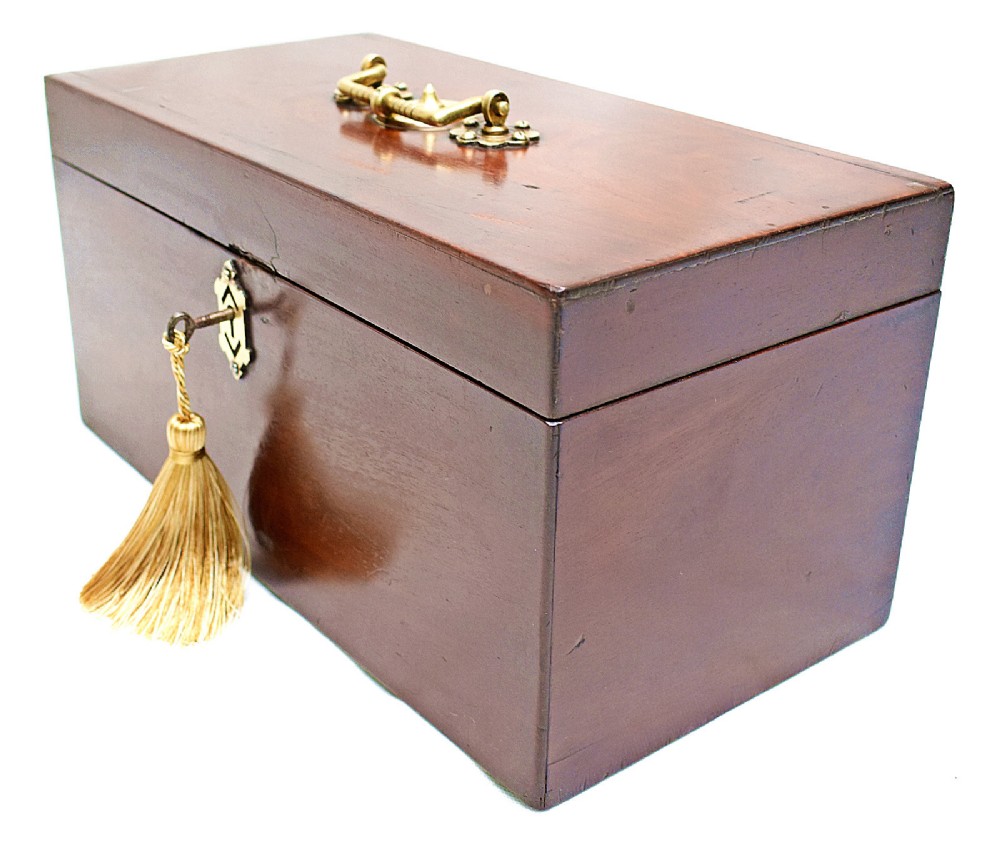 An open rectangular dark wood tea caddy featuring two internal covered compartments, a central cut glass mixing bowl, a green fabric-lined lid, and a key with a tassel inserted in the front lock. View VIII