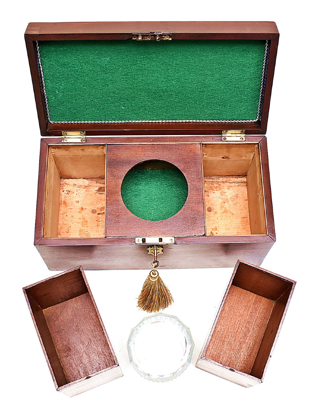 An open rectangular dark wood tea caddy featuring two internal covered compartments, a central cut glass mixing bowl, a green fabric-lined lid, and a key with a tassel inserted in the front lock. View X