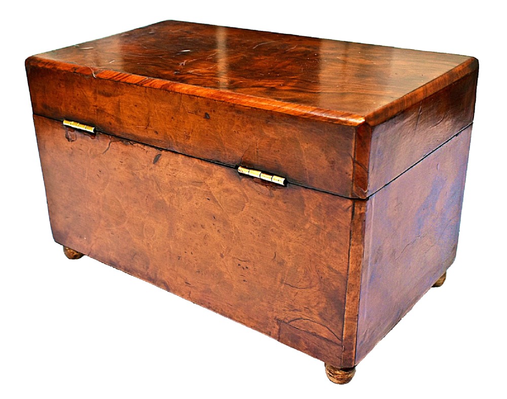 A rectangular mid-Victorian tea caddy crafted from figured burr walnut veneer with a central brass keyhole escutcheon and key. View IV