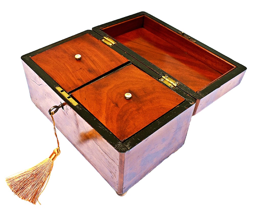 A rectangular mid-Victorian tea caddy crafted from figured burr walnut veneer with a central brass keyhole escutcheon and key. View VI