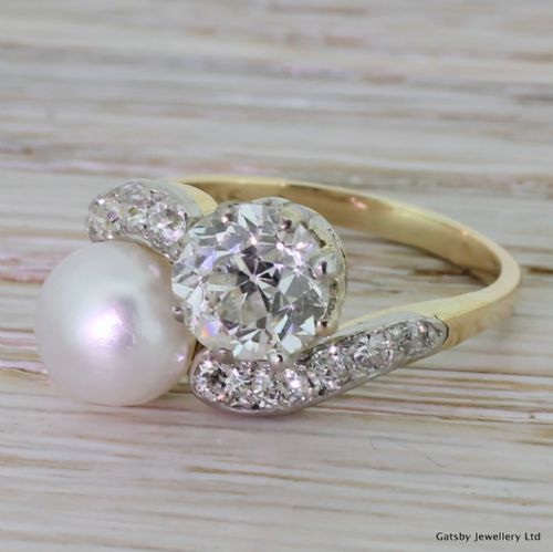 
Art Deco Natural Pearl & 1.36 Carat Old Cut Diamond Crossover Ring, Circa 1920
