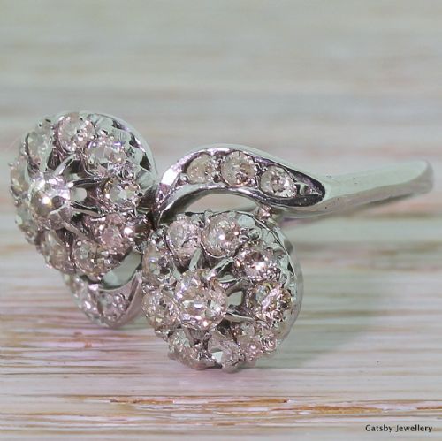 Mid-century 1.50 Carat Old Mine Cut Double Daisy Twist Ring, Circa 1940
