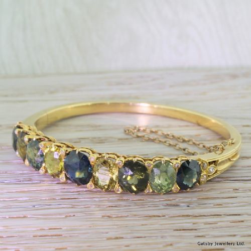 Victorian 14.50 Carat Multi Colour Sapphire Hinged Bangle, Circa 1850
