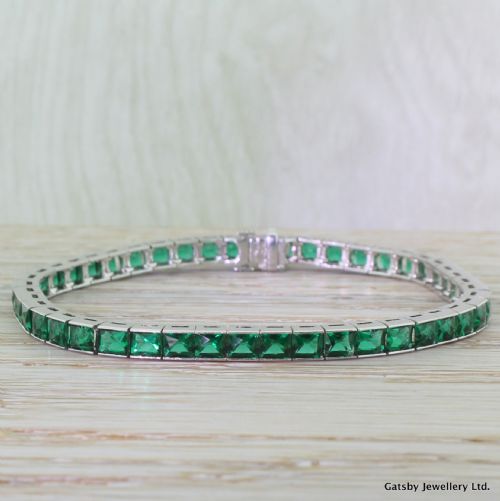 Art Deco 6.90 Carat French Cut Emerald Line Bracelet, Platinum, Circa 1930
