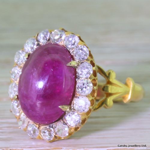 Victorian 10.00 Carat Natural Cabochon Ruby & Old Cut Diamond Cluster Ring, Circa 1890
