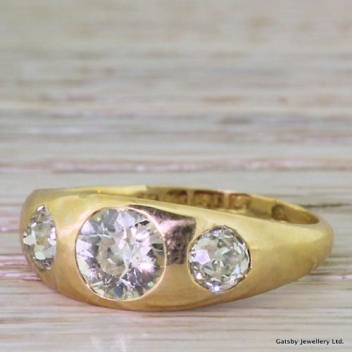 Victorian 1.52 Carat Old Cut Diamond Rub-over Trilogy Ring, Dated 1892
