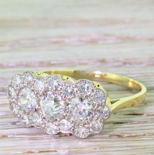 Mid Century 2.07 Carat Old Cut Diamond Triple Daisy Cluster Ring, Circa 1950
