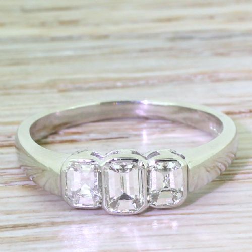 fig 1. Retro 0.75 Carat Emerald Cut Diamond Trilogy Ring, circa 1950