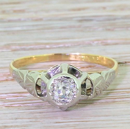 fig 1. A 1940s retro diamond engagement ring featuring a central old cut diamond set in a white metal mount with a yellow gold band.