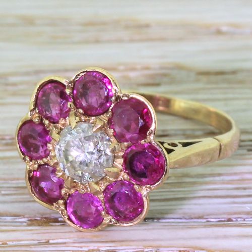 Retro 0.89 Carat Transitional Cut Diamond & Ruby Daisy Cluster, Circa 1945
