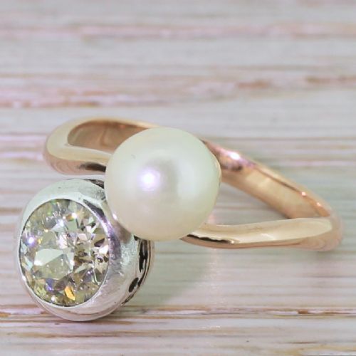 Edwardian 1.15 Carat Fancy Light Yellow Diamond & Pearl Crossover Ring, Circa 1905
