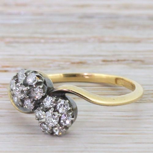 Art Deco 0.74 Carat Old Cut Diamond Double Daisy Crossover Ring, Circa 1920
