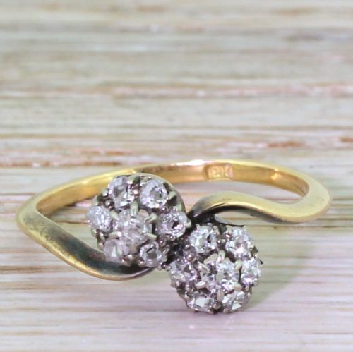 fig 1. Art Deco 0.74 Carat Old Cut Diamond Double Daisy Crossover Ring, circa 1920