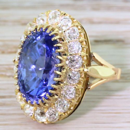 Edwardian 10.44 Carat Natural Ceylon Sapphire & Old Cut Diamond Cluster Ring, Circa 1905

