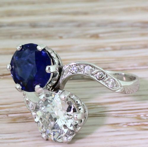 Art Deco 1.90 Carat Natural Sapphire & 1.59 Carat Old Cut Diamond Crossover Ring, Circa 1925
