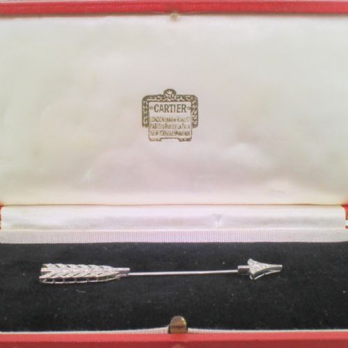fig 1. An antique diamond and platinum arrow jabot pin displayed inside a fitted presentation case.