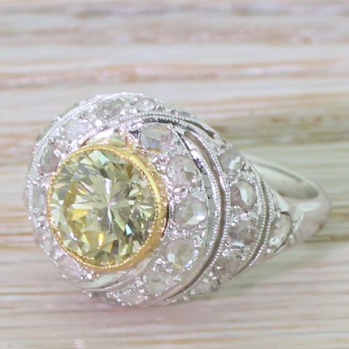 Retro 1.66 Carat Fancy Light Greenish Yellow Transitional Cut Bombé Ring, Circa 1945
