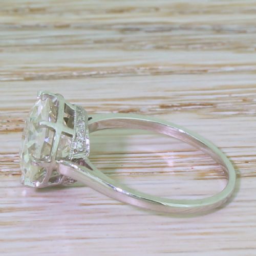 fig 2. An Art Deco diamond solitaire ring featuring a large round Old European cut diamond held in a multi-prong setting on a smooth metal band.