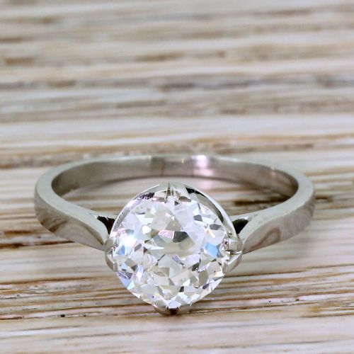 fig 1. An Art Deco ring crafted in polished silver-toned metal featuring a single central old European cut diamond held in a claw setting.