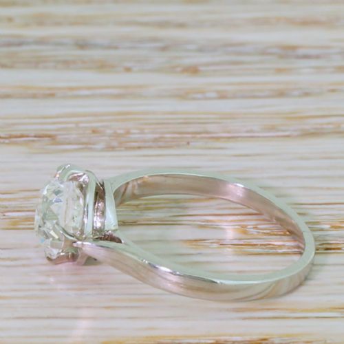 fig 2. An Art Deco ring crafted in polished silver-toned metal featuring a single central old European cut diamond held in a claw setting.