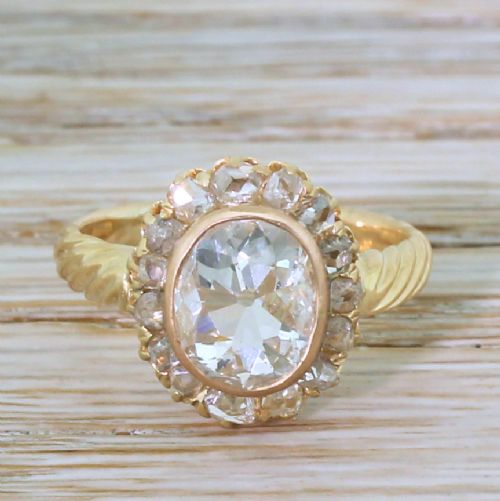 fig 1. Mid Century 1.24 Carat Old Oval Cut Diamond Cluster Ring, circa 1950
