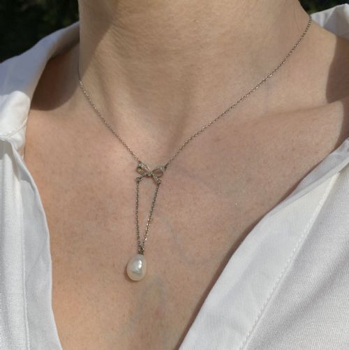 fig 1. Edwardian Natural Pearl & Diamond Bow Pendant, circa 1910