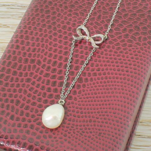 fig 2. Edwardian Natural Pearl & Diamond Bow Pendant, circa 1910
