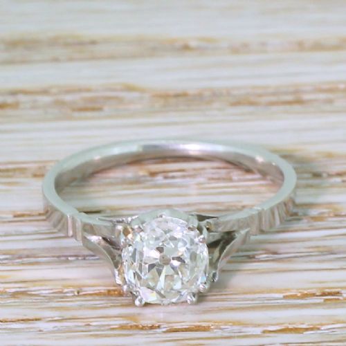 fig 1. An Art Deco platinum engagement ring featuring a central old cut diamond in a claw setting with split shoulders.
