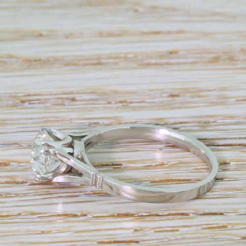 fig 2. An Art Deco platinum engagement ring featuring a central old cut diamond in a claw setting with split shoulders.