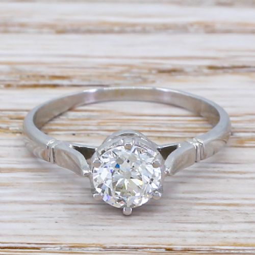 fig 1. An Art Deco diamond engagement ring featuring a central old cut diamond set in platinum with reeded shoulders.