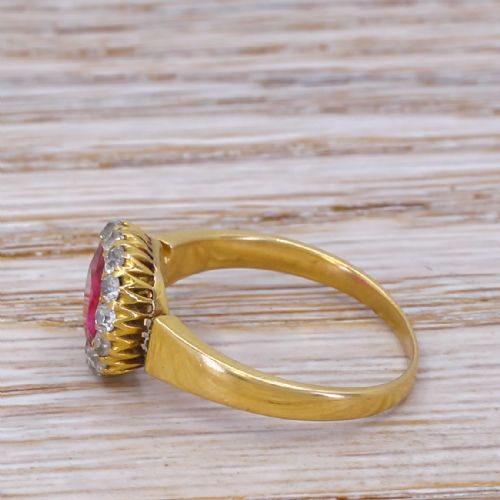 fig 2. A Victorian yellow gold ring featuring a central cushion-cut pinkish-red Burmese spinel surrounded by a halo of small diamonds.