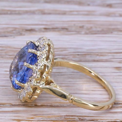 fig 2. An Art Deco cluster ring featuring a large oval Ceylon sapphire surrounded by a halo of round diamonds mounted on a gold band.