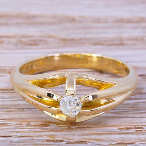 fig 1. A late Victorian yellow gold ring featuring a central old cut diamond set between split shoulders.