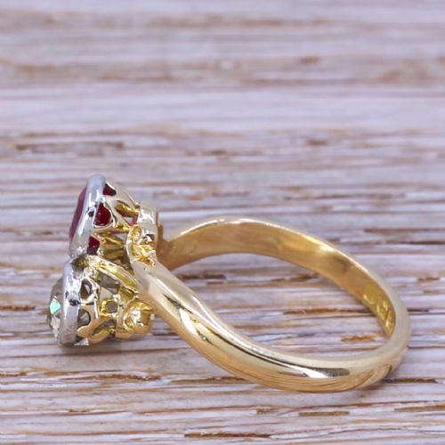 fig 2. An Edwardian yellow gold crossover ring featuring a bezel-set round red synthetic ruby paired with an old cut diamond.