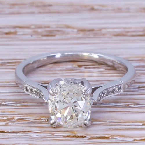 fig 1. An Art Deco platinum engagement ring set with a central old cut diamond held in claw settings with delicate millegrain shoulders.