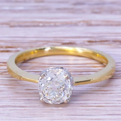 fig 1. An Edwardian diamond solitaire ring featuring an old cut diamond set in platinum claws on a slender yellow gold band.