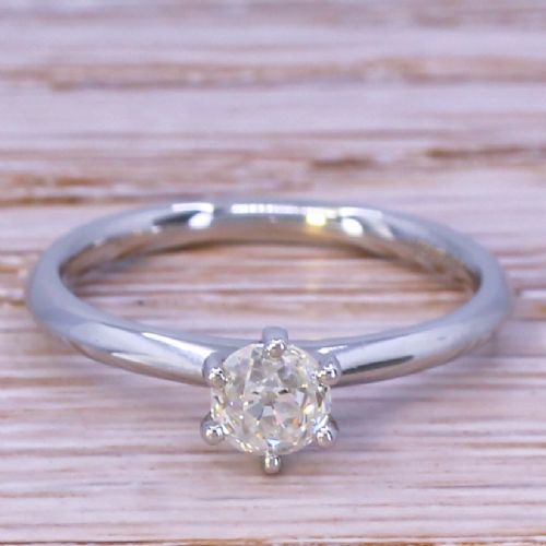 fig 1. A single old-cut diamond set in a polished platinum band with six claws.
