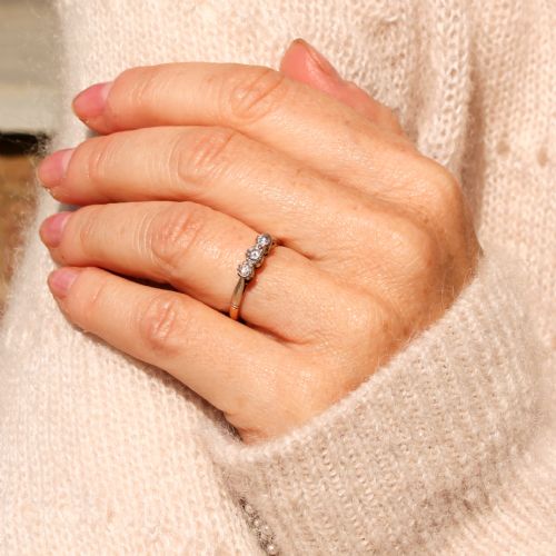 fig 1. A mid-century three-stone diamond ring crafted with an 18ct yellow gold shank and platinum settings.