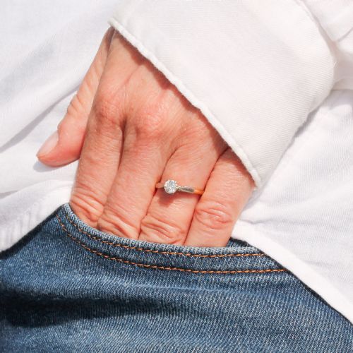 fig 1. A mid-century engagement ring featuring a single old-cut diamond set in platinum shoulders on a yellow gold band.
